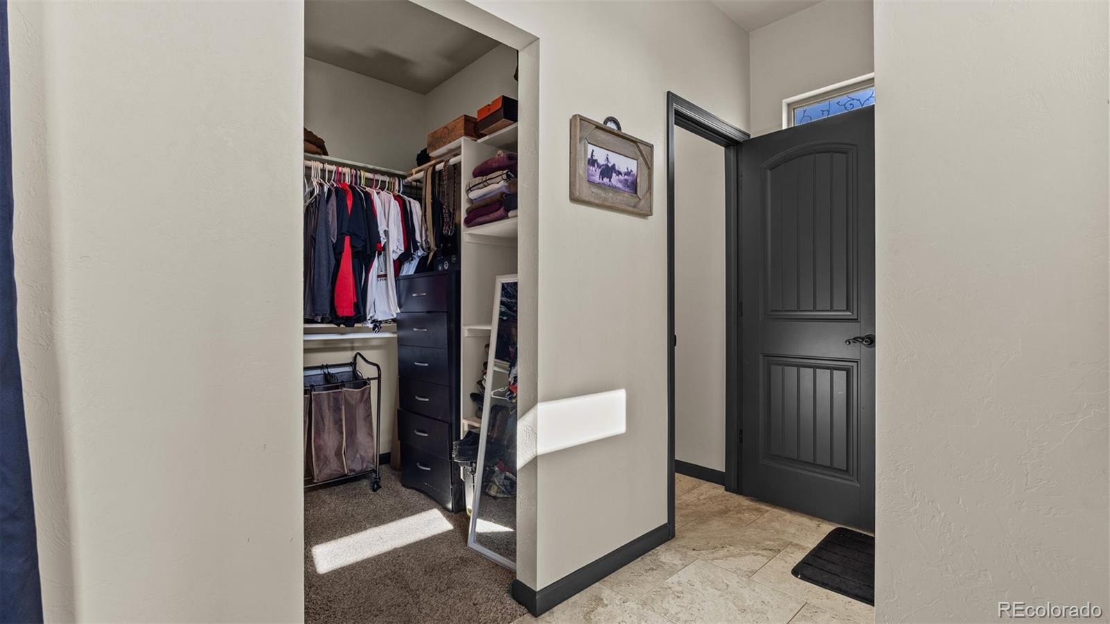 556-32 32 5/8 Road Clifton, CO 81520 - Photo 20 of 28 a view of walk in closet with clothes and shoes