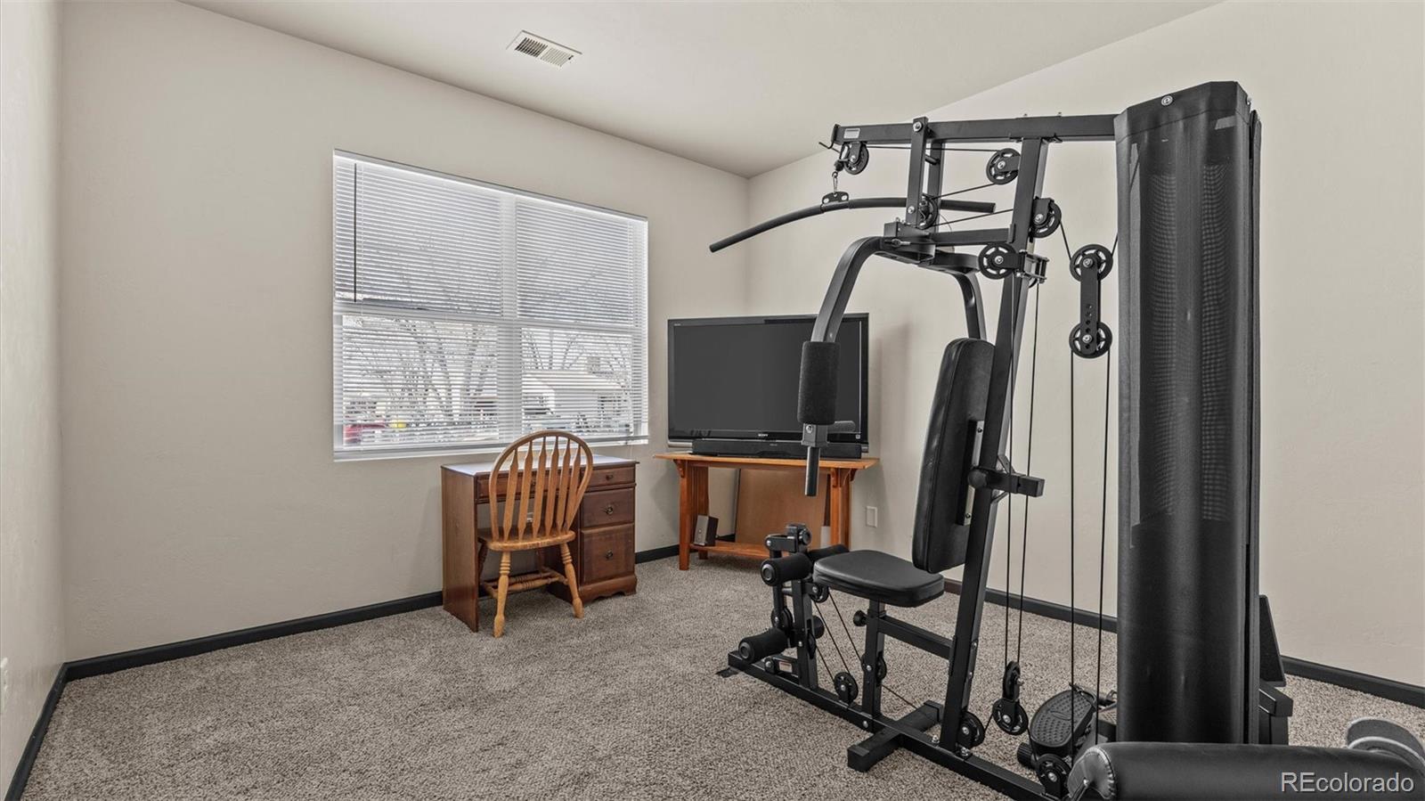 556-32 32 5/8 Road Clifton, CO 81520 - Photo 23 of 28 a view of a room with gym equipment