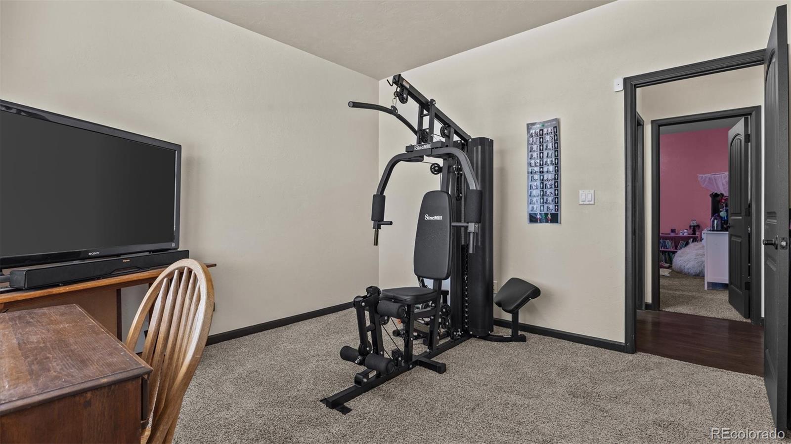 556-32 32 5/8 Road Clifton, CO 81520 - Photo 24 of 28 a view of a room with gym equipment