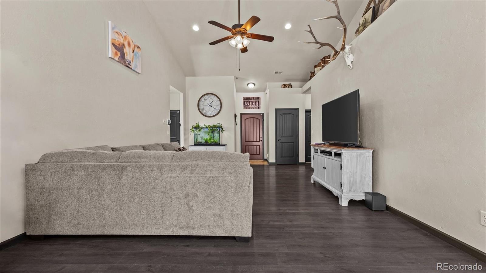 556-32 32 5/8 Road Clifton, CO 81520 - Photo 7 of 28 a living room with furniture and a flat screen tv