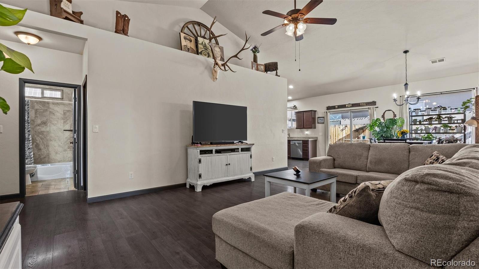 556-32 32 5/8 Road Clifton, CO 81520 - Photo 9 of 28 a living room with furniture and a flat screen tv