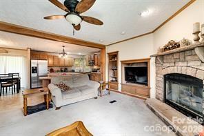 179 Fresh Water Rdg Road Whittier, NC 28789 - Photo 14 of 48 a living room with furniture and a fireplace