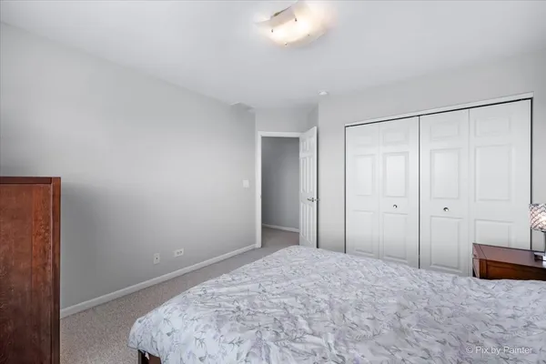 a bedroom with a bed and a cabinets