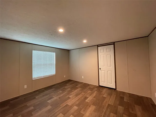 a white toilet sitting next to a bath tub