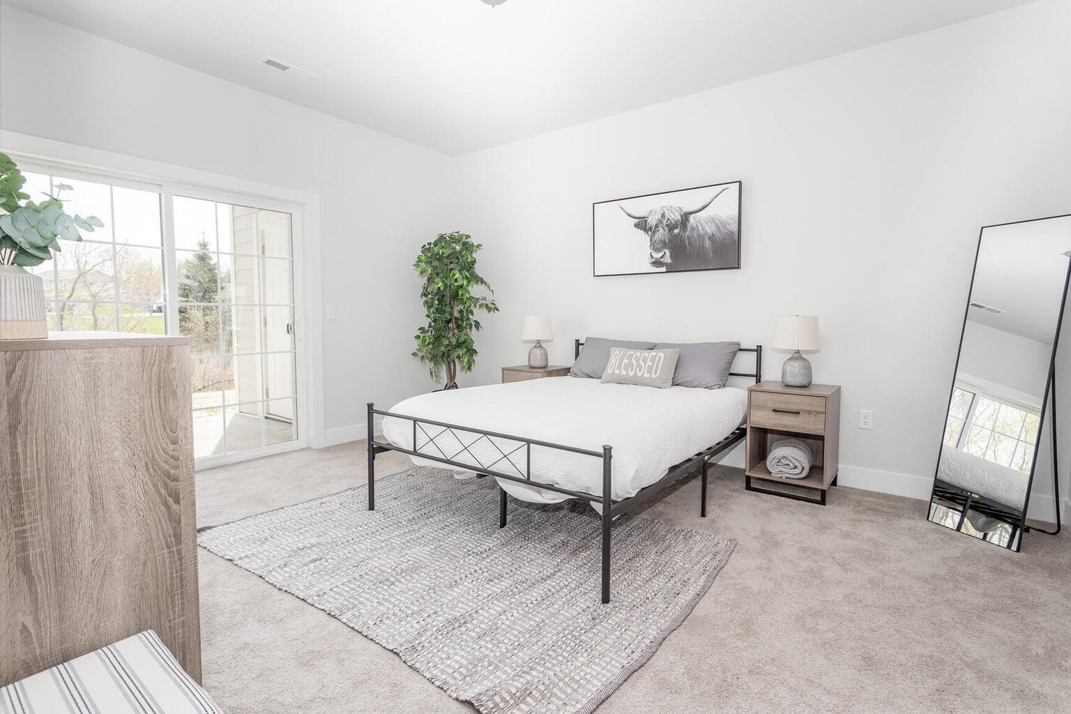 455 Hillary Circle, Unit B Johnson Creek, WI 53038 - Photo 9 of 21 Another set of doors lead out to deck