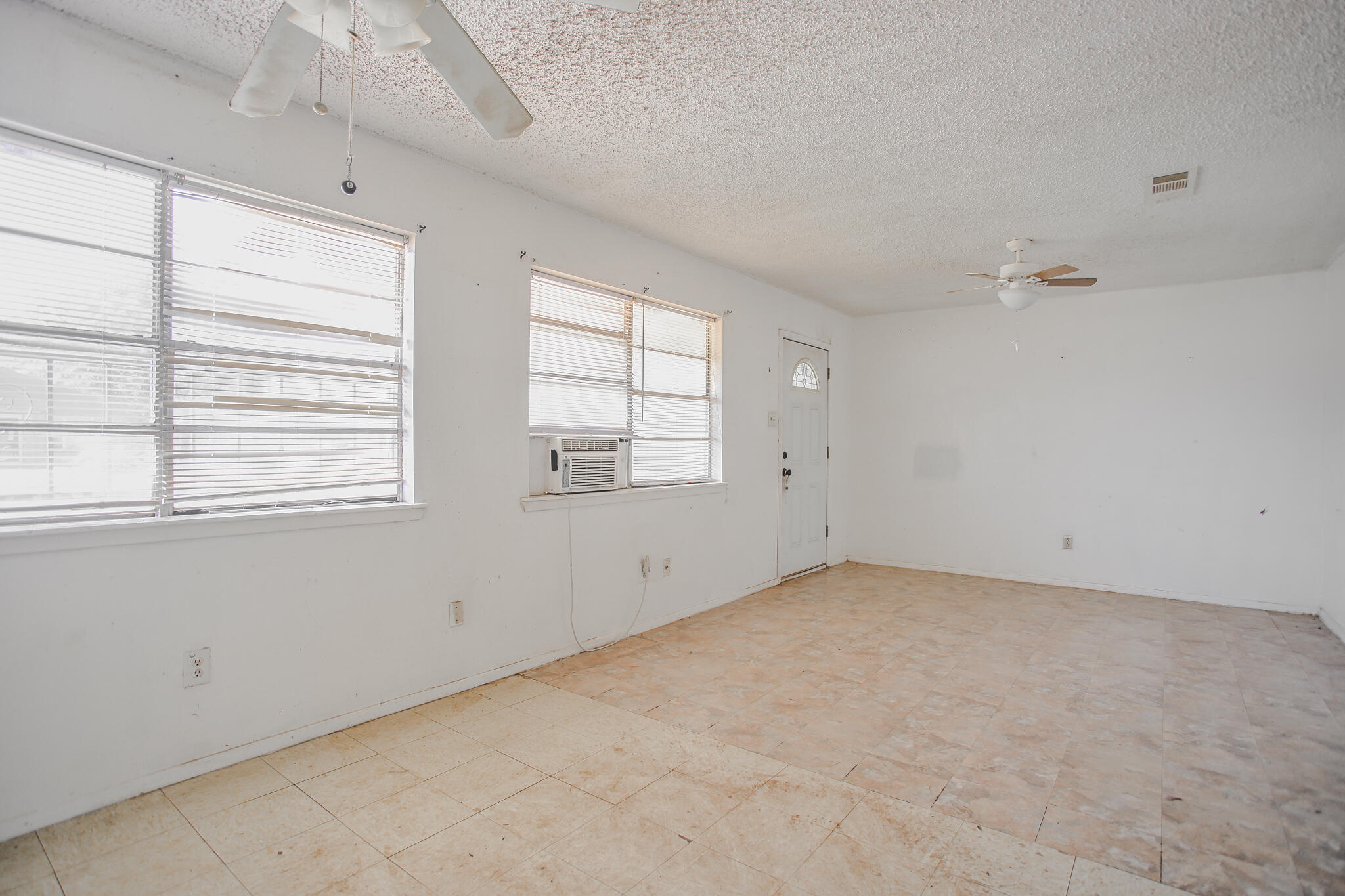 2620 Amherst Street Lubbock, TX 79415 - Photo 11 of 22 an empty room with windows