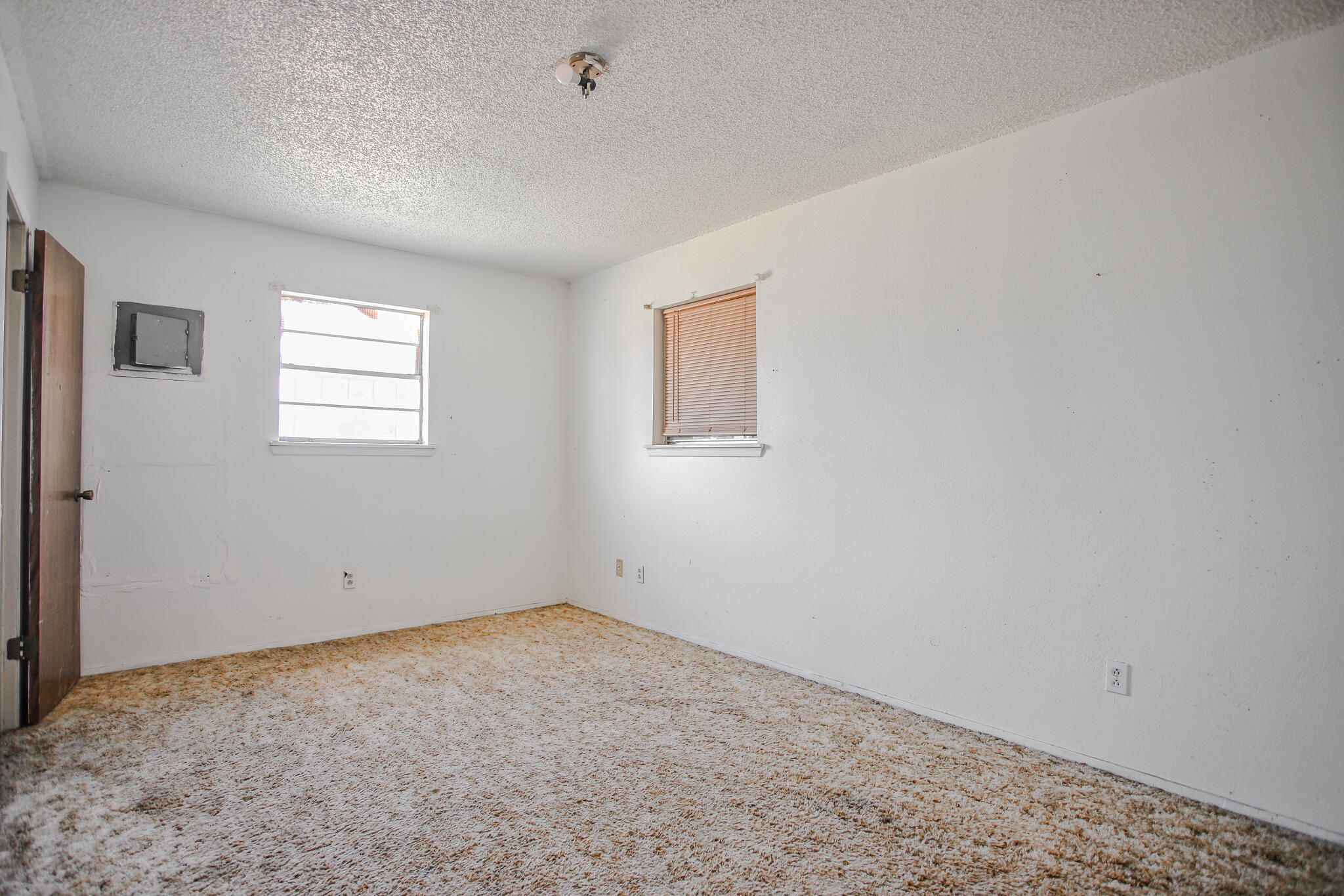2620 Amherst Street Lubbock, TX 79415 - Photo 14 of 22 an empty room with a window
