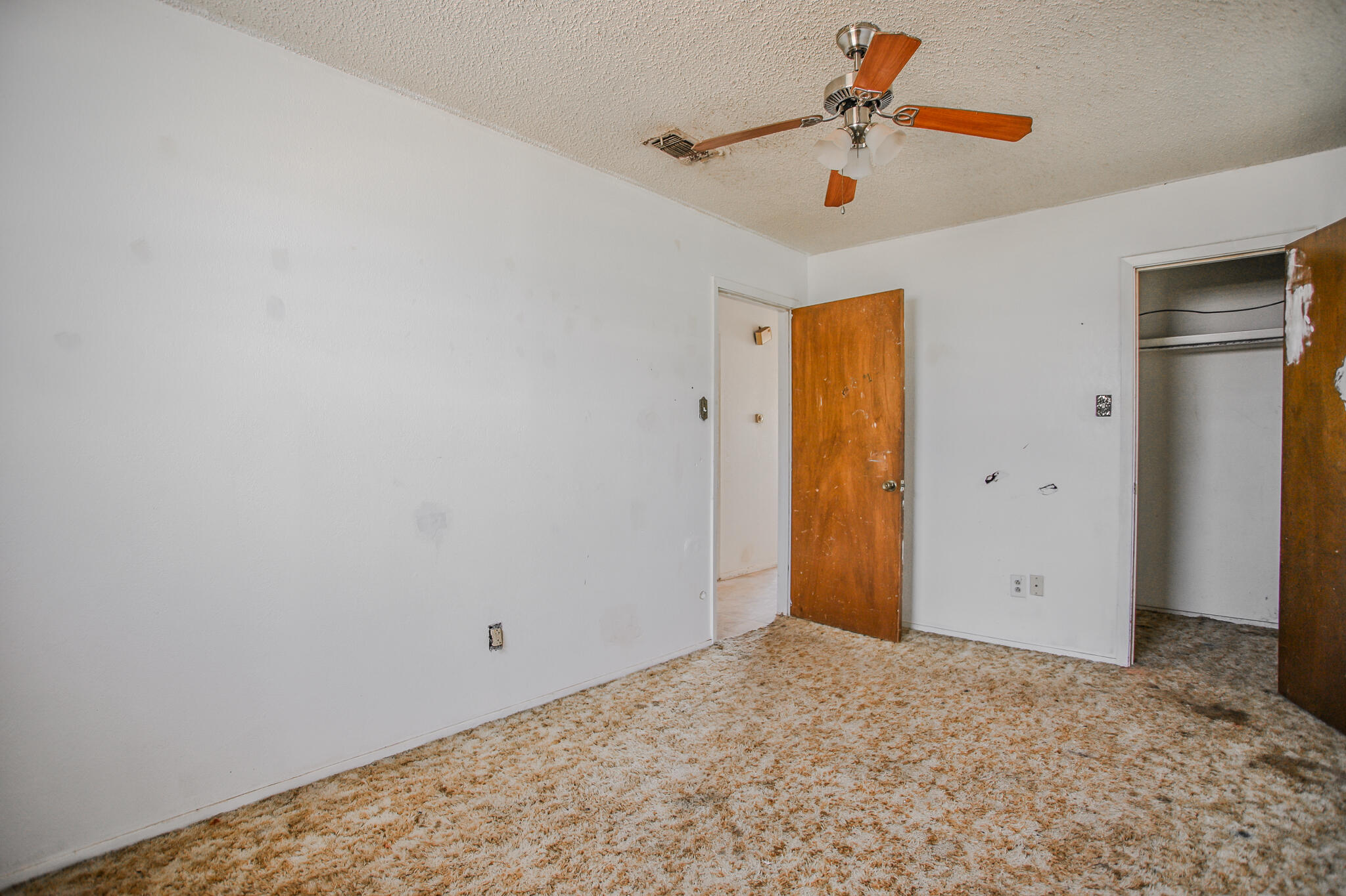 2620 Amherst Street Lubbock, TX 79415 - Photo 20 of 22 a view of a room with a ceiling fan and window