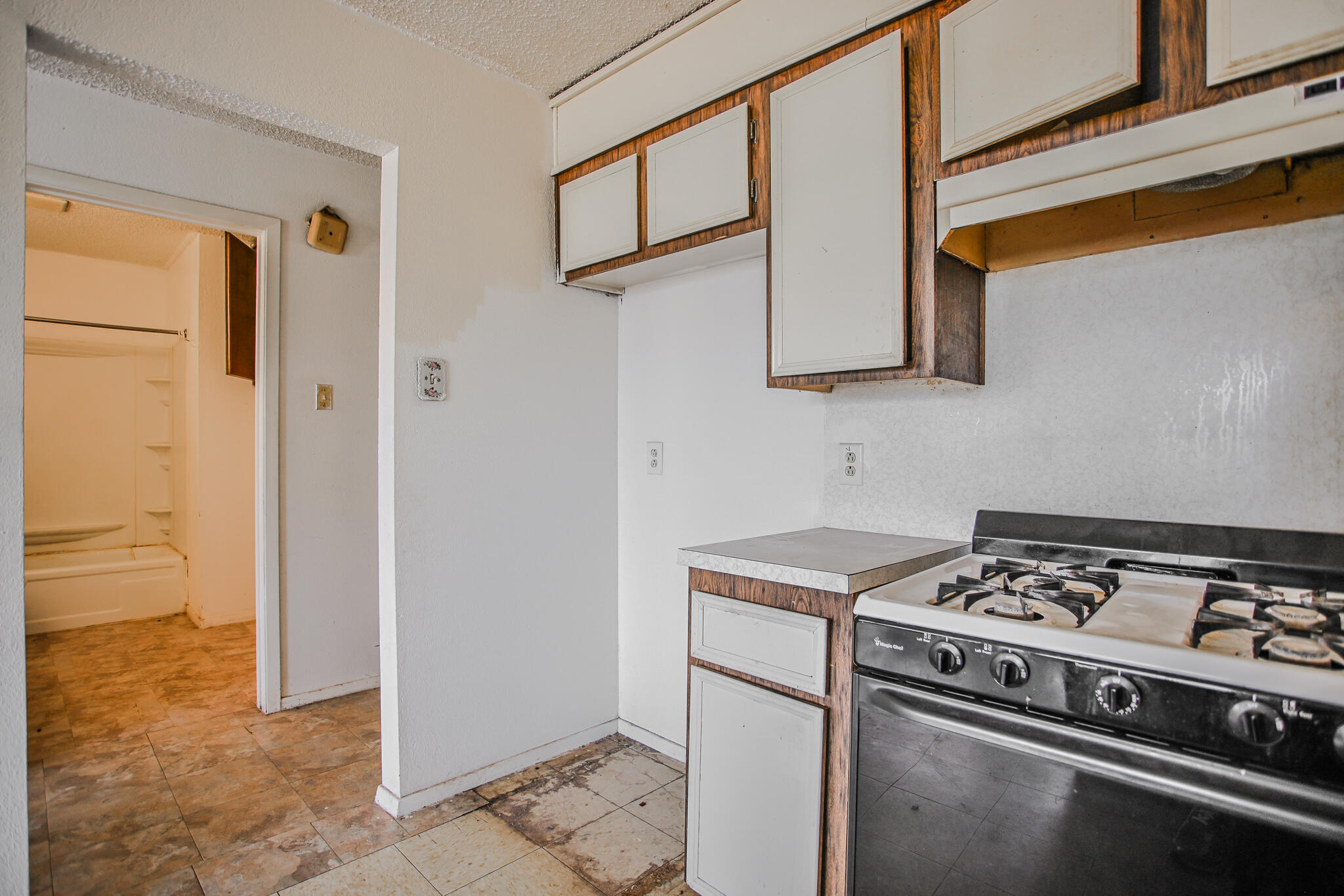 2620 Amherst Street Lubbock, TX 79415 - Photo 7 of 22 a kitchen with stainless steel appliances granite countertop a stove and a refrigerator