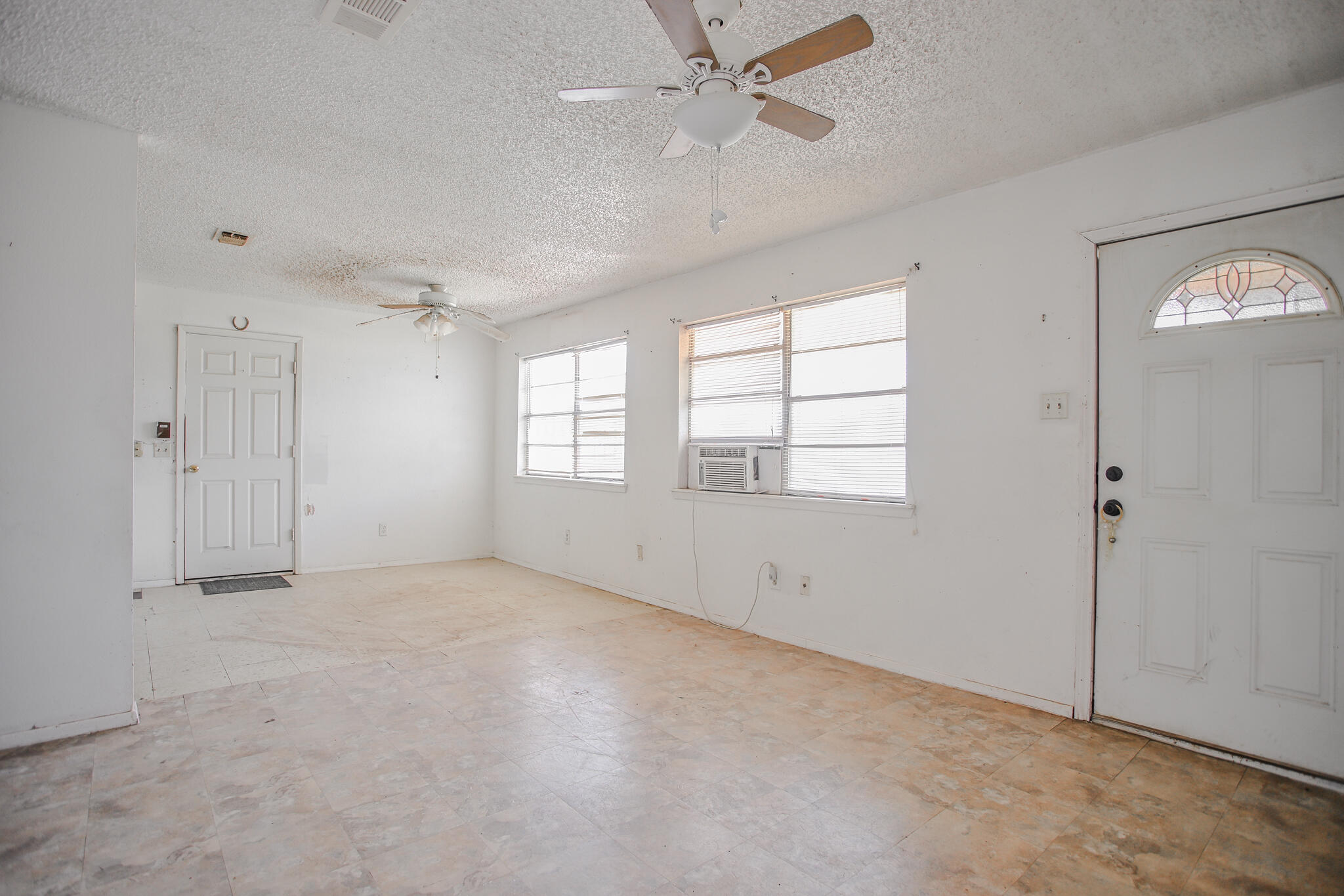 2620 Amherst Street Lubbock, TX 79415 - Photo 9 of 22 a view of an empty room with a window