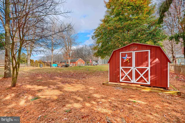 a sign board with parking space in back