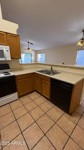 a kitchen with stainless steel appliances a sink and a stove