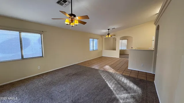 a view of a kitchen with a sink cabinet and a chandelier