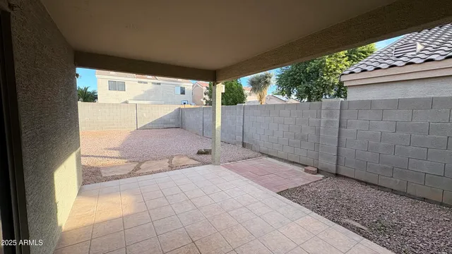 a view of a backyard of the house