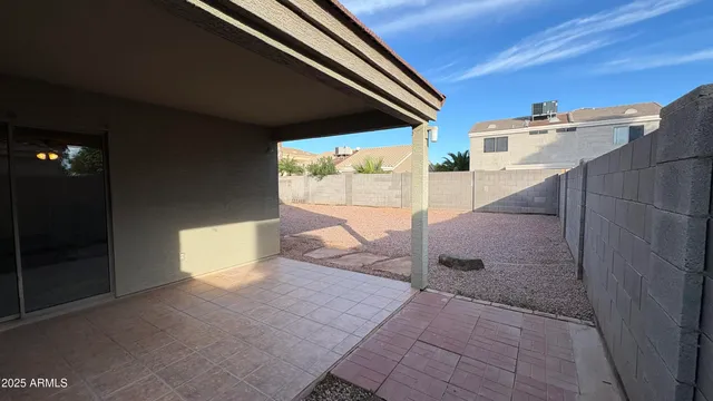 a view of an outdoor kitchen and a window