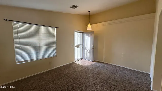 a view of an empty room with a window