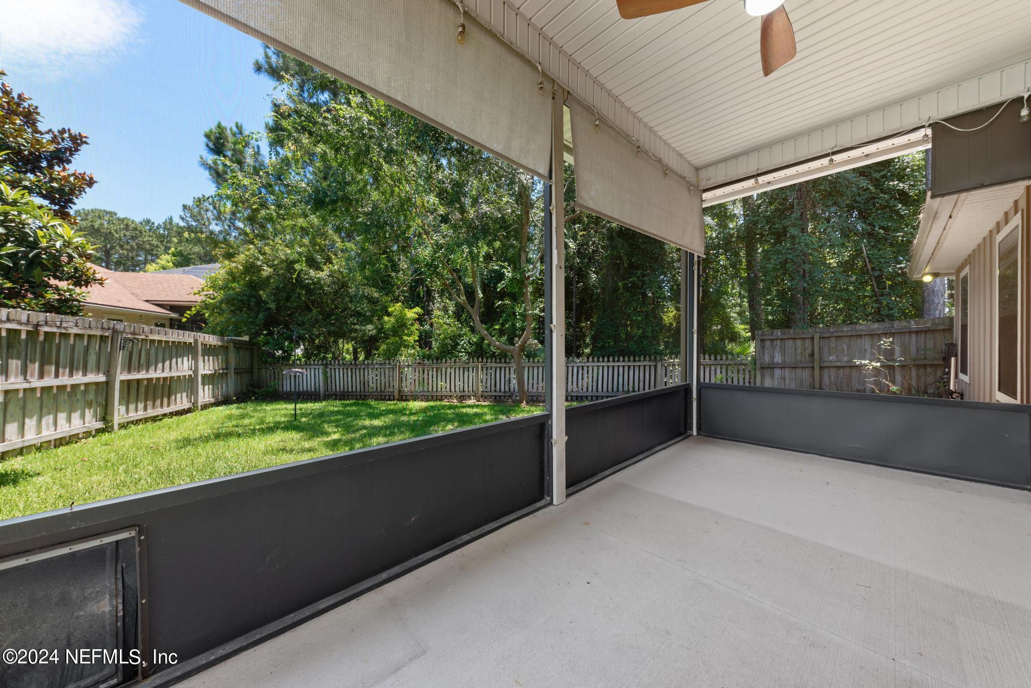 86192 Fortune Drive Yulee, FL 32097 - Photo 21 of 26 a view of a porch with a yard