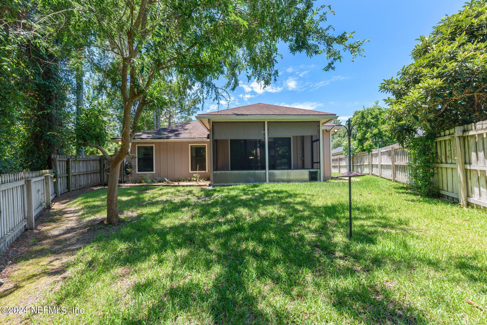 86192 Fortune Drive Yulee, FL 32097 - Photo 25 of 26 a view of a house with a yard