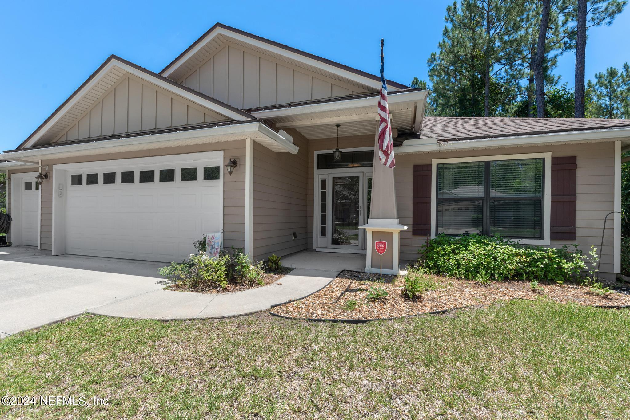 86192 Fortune Drive Yulee, FL 32097 - Photo 3 of 26 a front view of a house with a yard