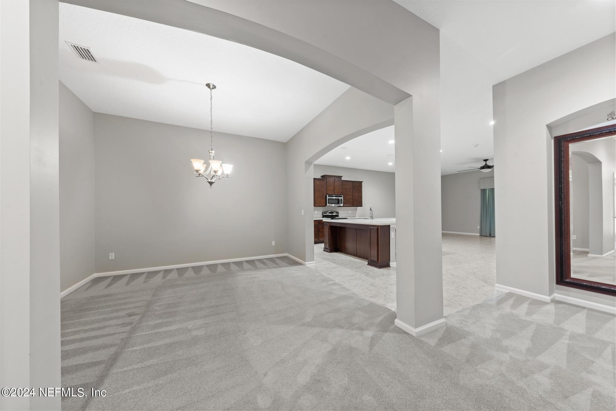 86192 Fortune Drive Yulee, FL 32097 - Photo 5 of 26 a view of a kitchen with a sink and a stove