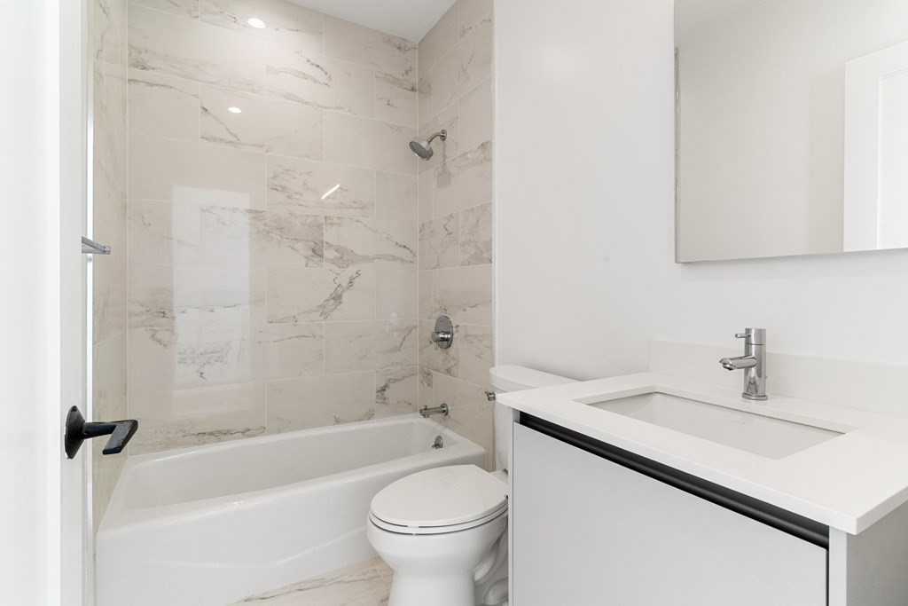 7 Columbus Square, Unit PH Boston, MA 02116 - Photo 21 of 28 a bathroom with a sink a toilet and a bathtub