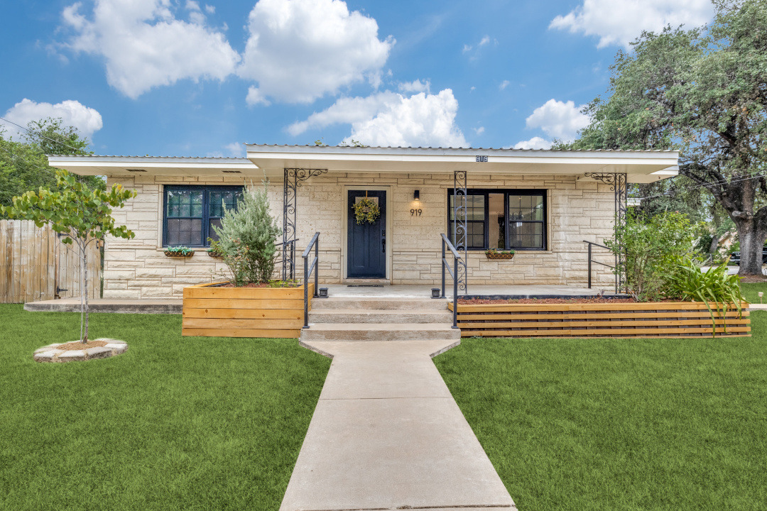 front view of a house with a yard
