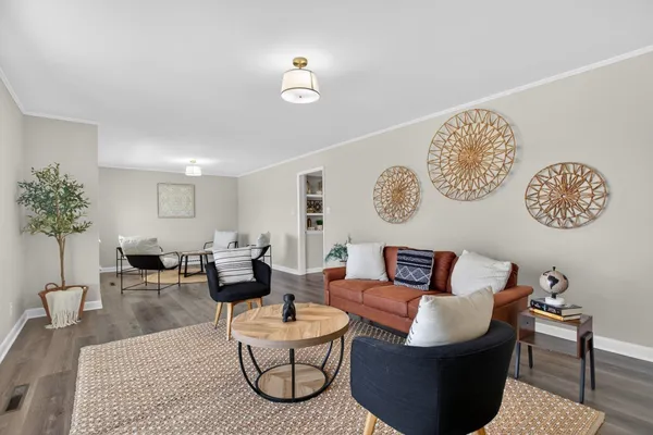 a view of a dining room with furniture window and wooden floor