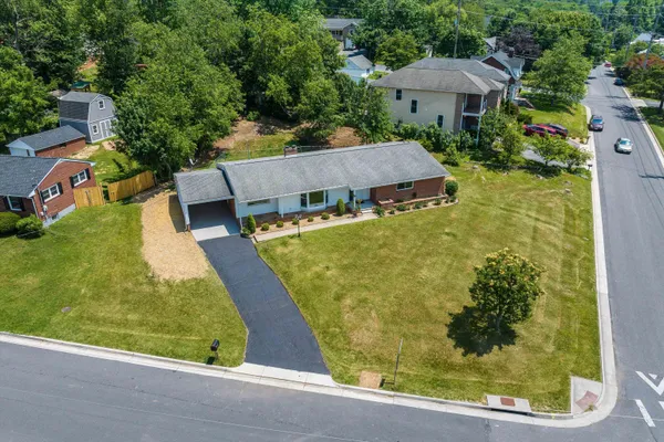 an aerial view of a house with a garden