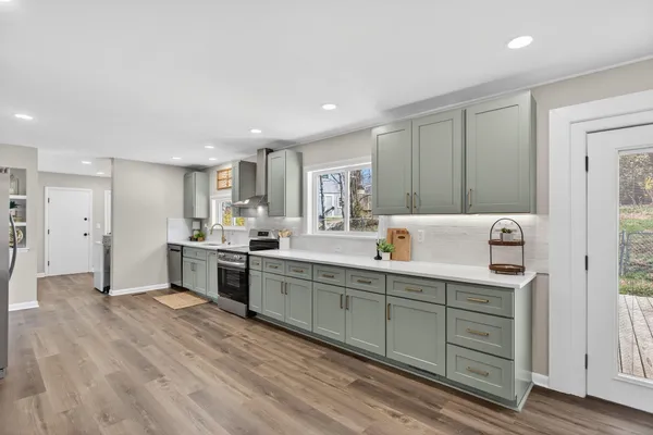 a front view of a house with wooden floor and fence