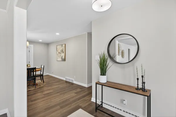 a living room with furniture and a potted plant