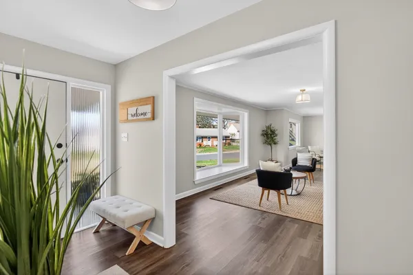 a work room with furniture and a painting on the wall
