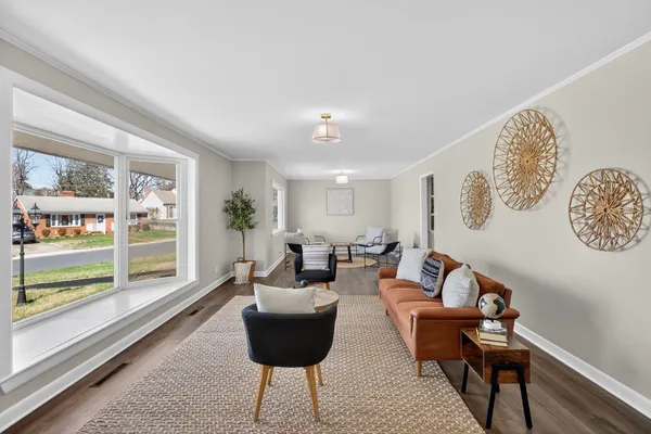 a view of a dining room with furniture window and wooden floor