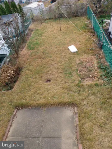 a room with a window and a ceiling fan