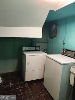 a bathroom with a granite countertop sink a toilet and vanity