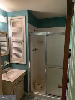 a bathroom with a sink toilet and mirror