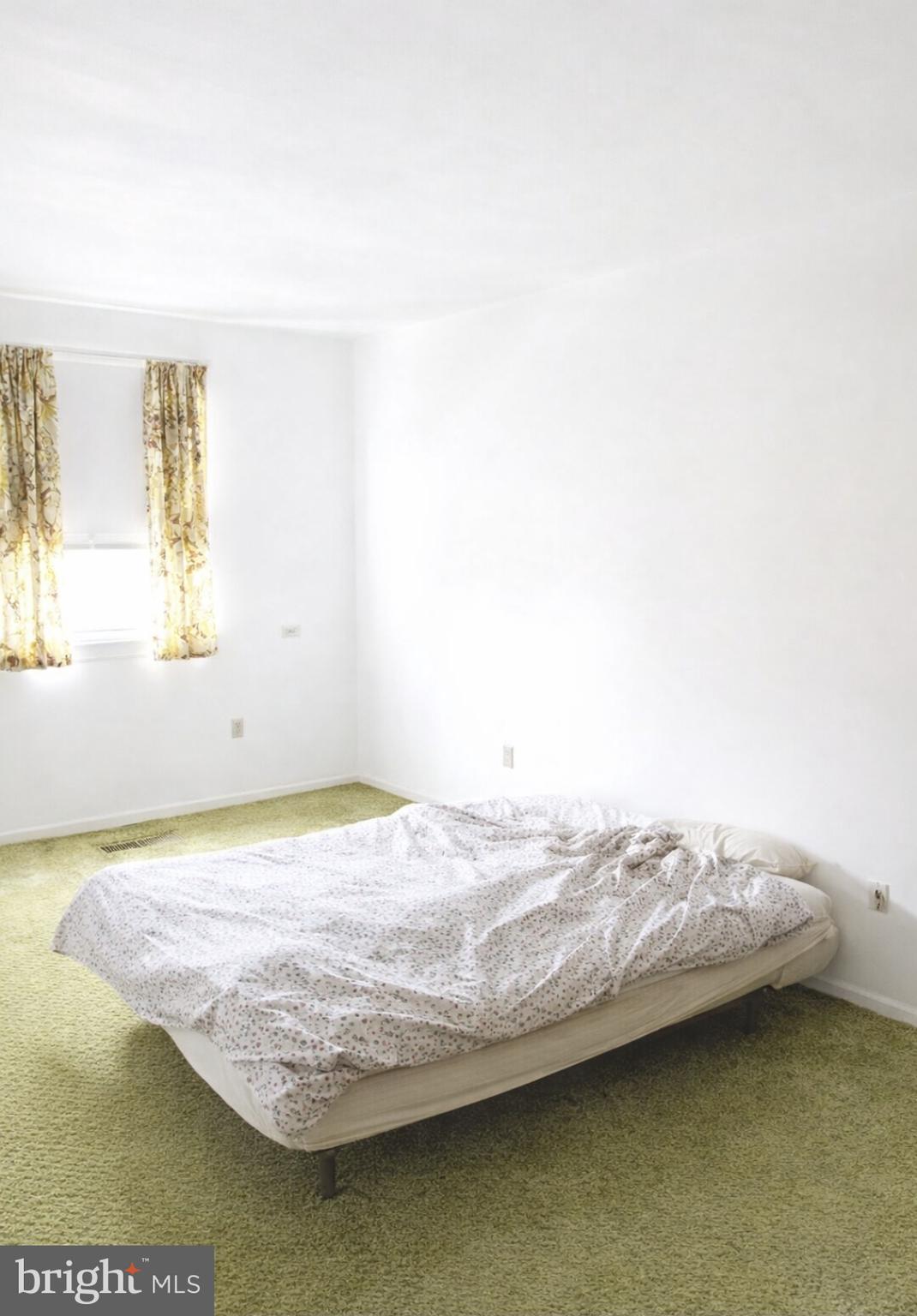 3230 Comly Road Philadelphia, PA 19154 - Photo 25 of 29 a view of a bedroom with a bed and wooden floor