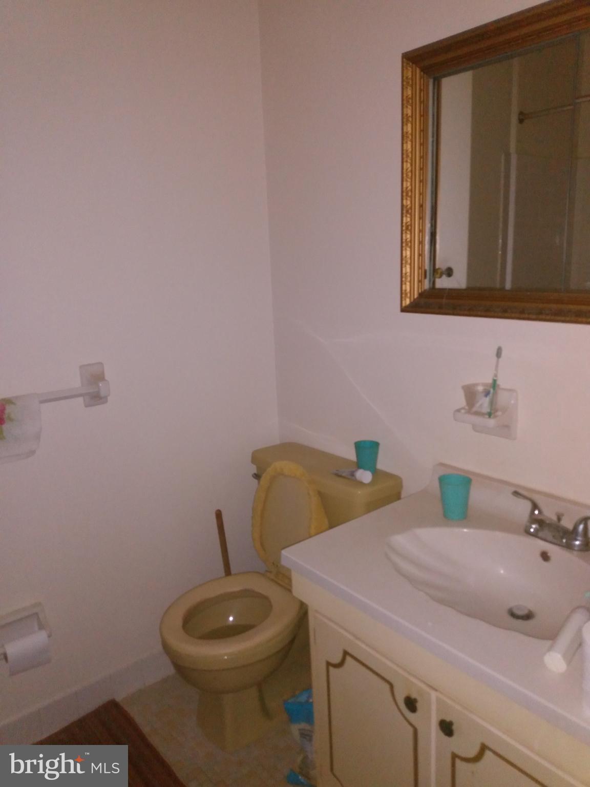 3230 Comly Road Philadelphia, PA 19154 - Photo 26 of 29 a bathroom with a sink a toilet and mirror