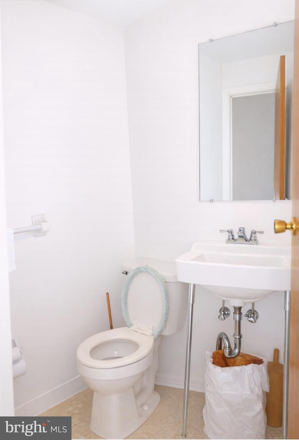 3230 Comly Road Philadelphia, PA 19154 - Photo 28 of 29 a bathroom with a toilet a sink and mirror