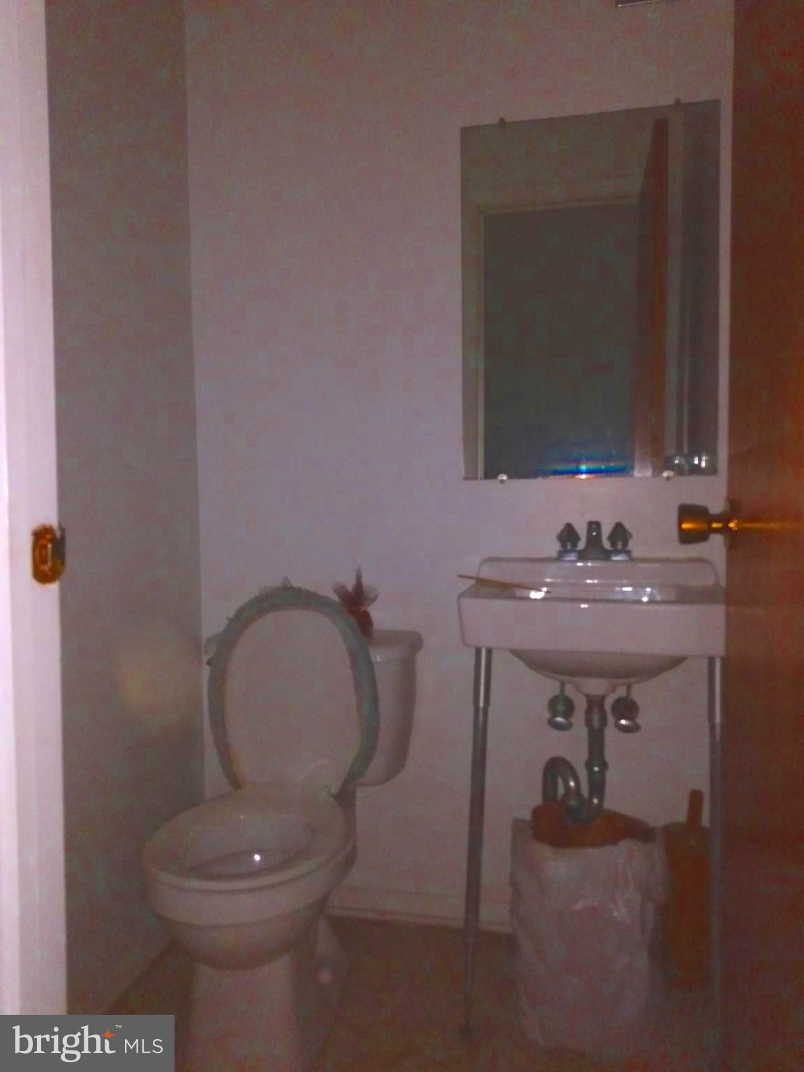 3230 Comly Road Philadelphia, PA 19154 - Photo 28 of 29 a bathroom with a sink toilet and mirror