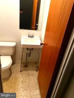 a bathroom with a sink and a toilet