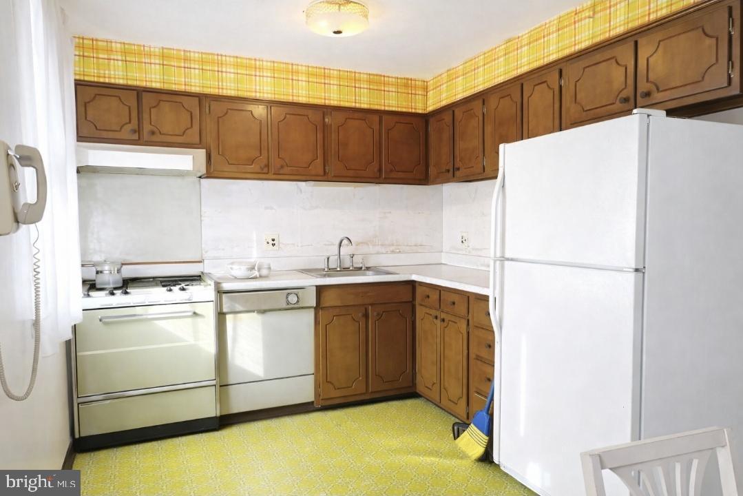 3230 Comly Road Philadelphia, PA 19154 - Photo 8 of 29 a white refrigerator freezer sitting in a kitchen
