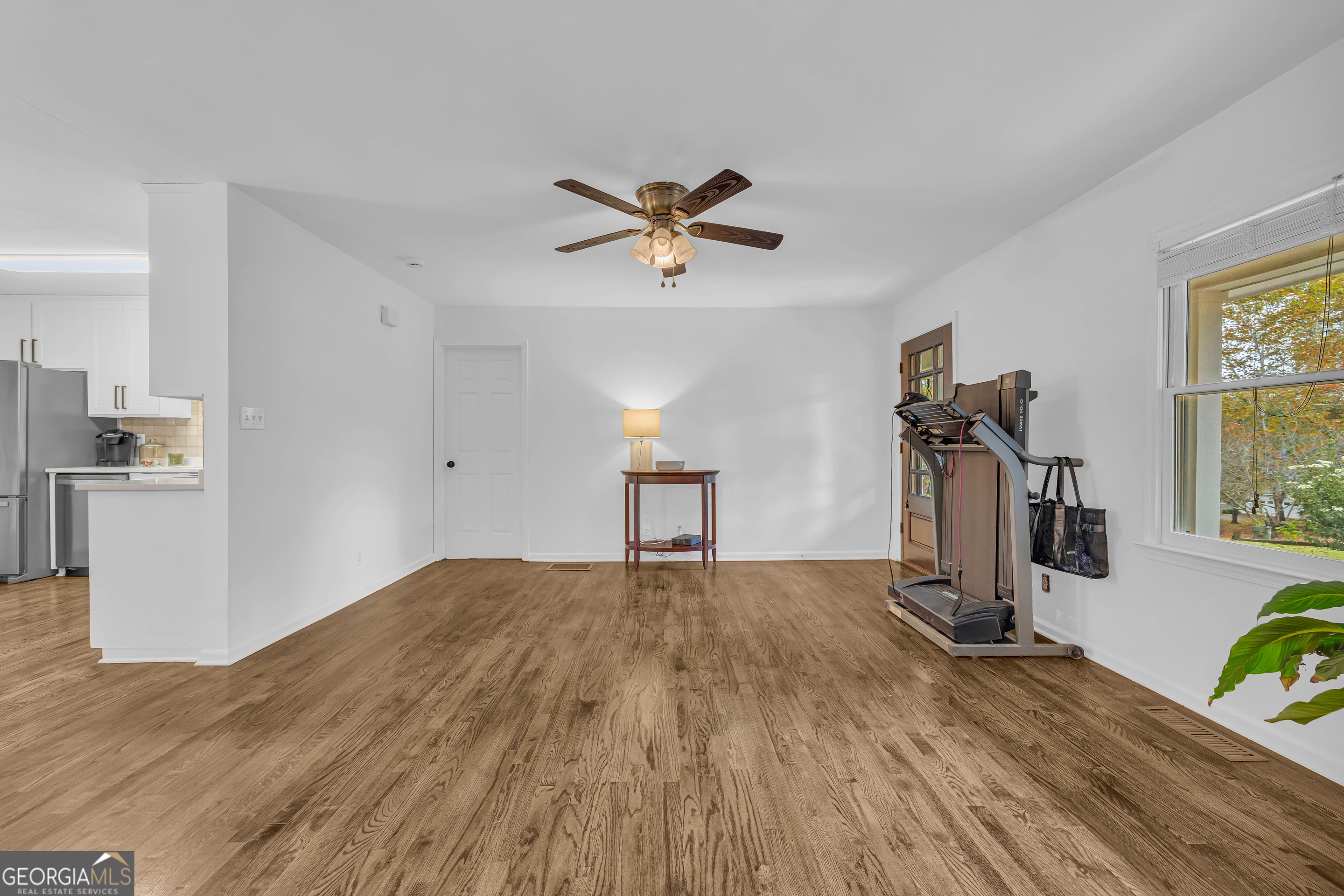 619 Watson Street Toccoa, GA 30577 - Photo 11 of 28 a view of a livingroom with a hardwood floor and a ceiling fan