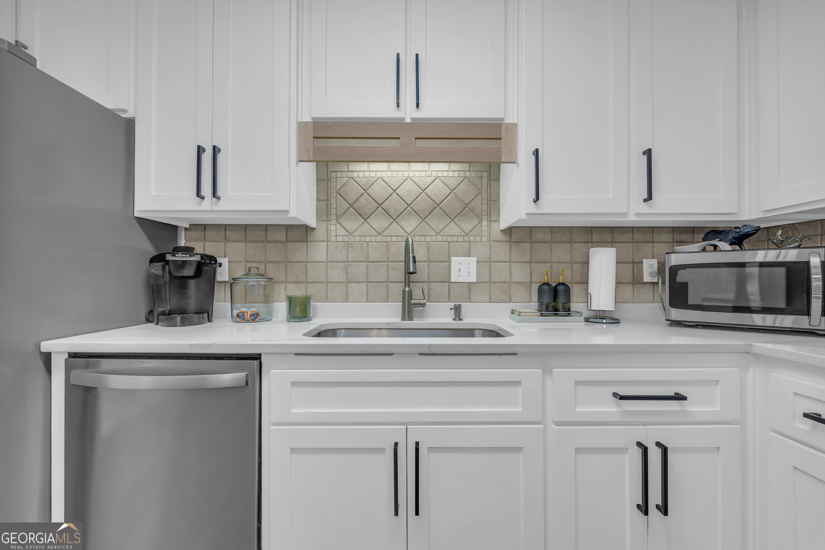 619 Watson Street Toccoa, GA 30577 - Photo 18 of 28 a kitchen with stainless steel appliances granite countertop a sink and a stove