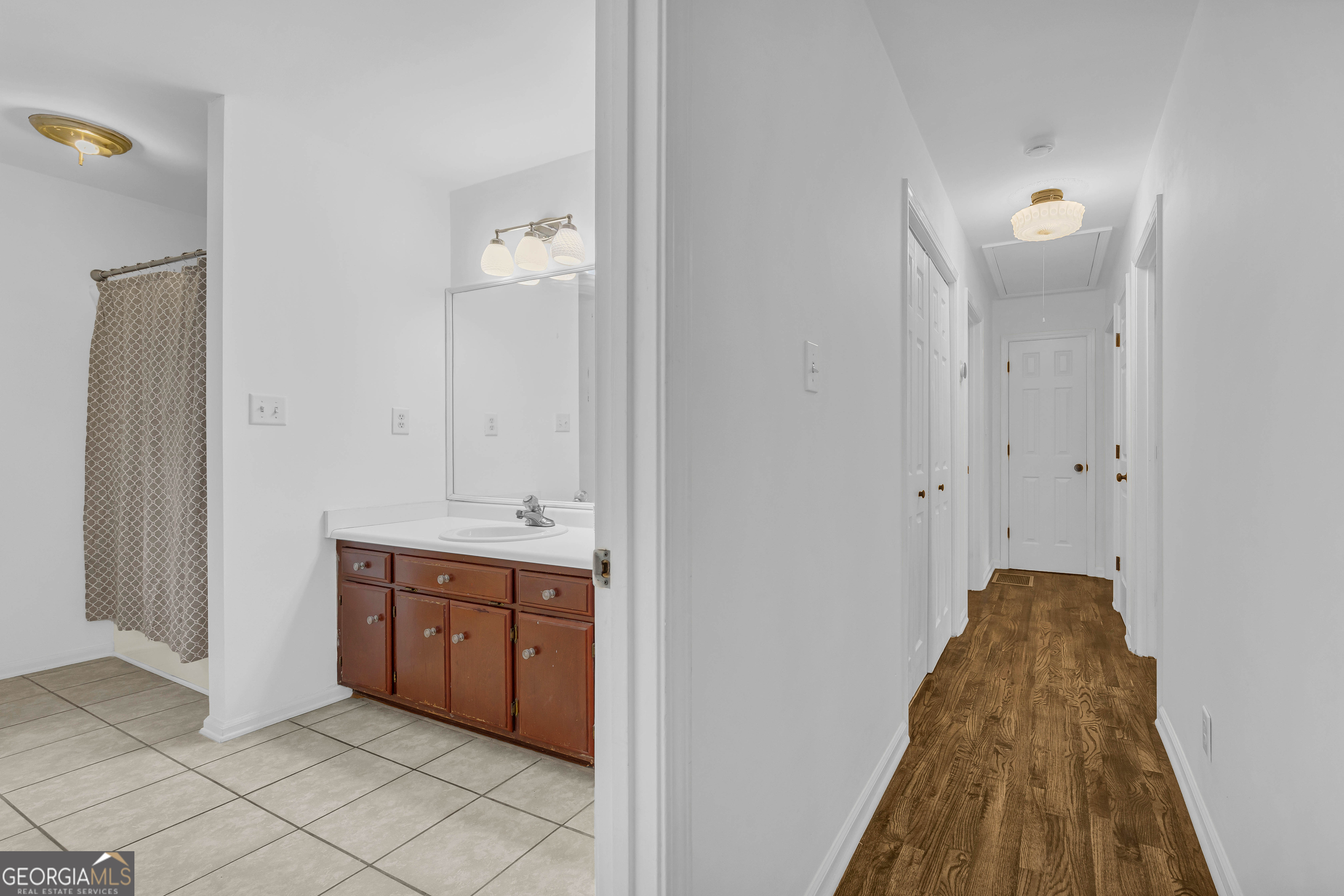 619 Watson Street Toccoa, GA 30577 - Photo 20 of 28 a spacious bathroom with a sink and a mirror