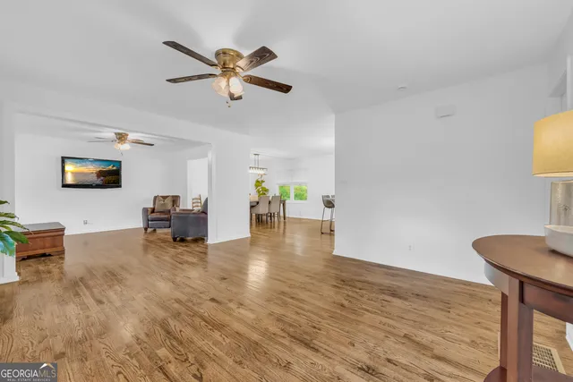 a view of livingroom with furniture and a flat screen tv