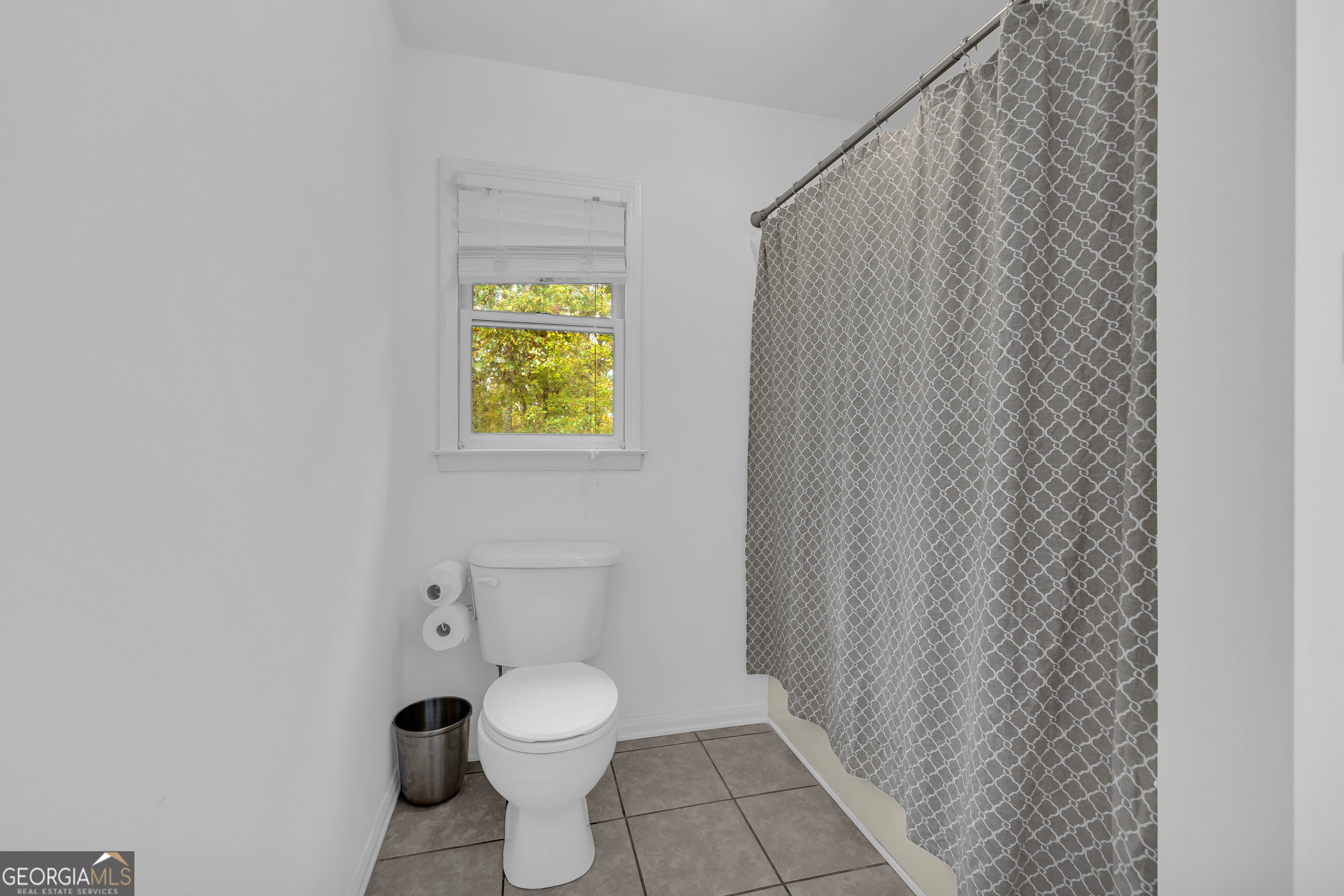 619 Watson Street Toccoa, GA 30577 - Photo 22 of 28 a white toilet sitting next to a small window