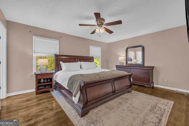 a view of an empty room with window and cabinet