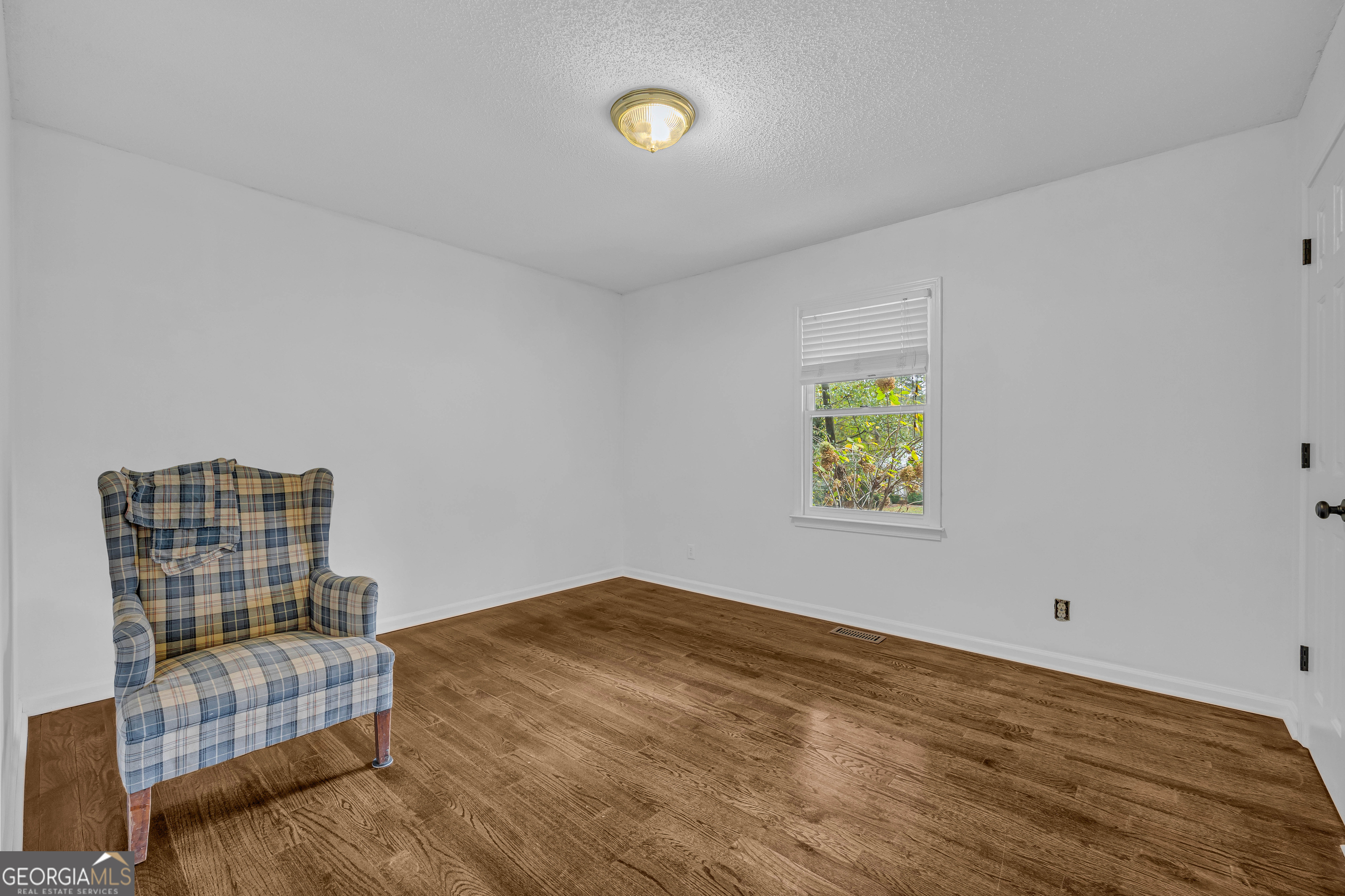 619 Watson Street Toccoa, GA 30577 - Photo 27 of 28 a view of an empty room with window and cabinet