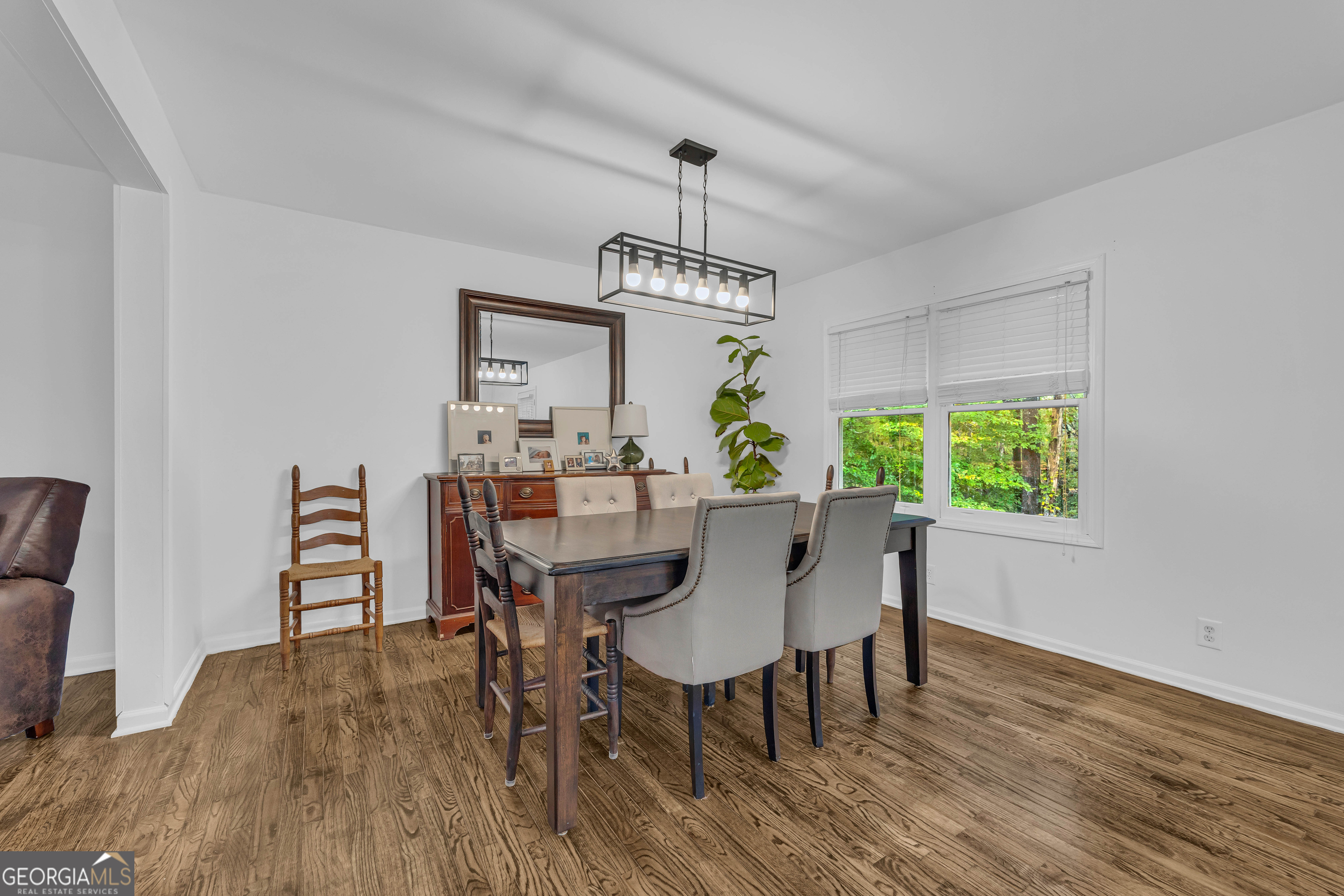 619 Watson Street Toccoa, GA 30577 - Photo 4 of 28 a view of a dining room with furniture window and wooden floor
