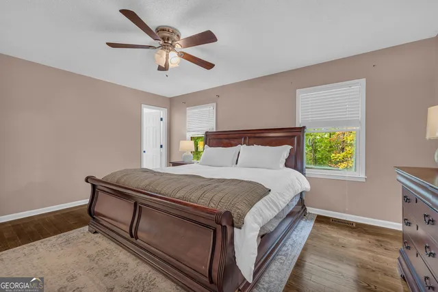 a bedroom with a bed and window